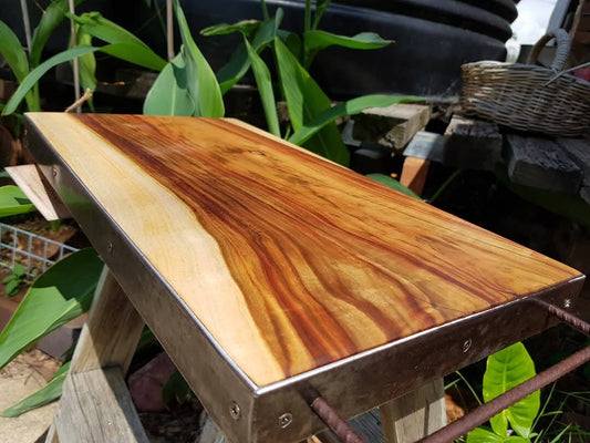 Why are timber chopping boards better than stainless steel or plastic?