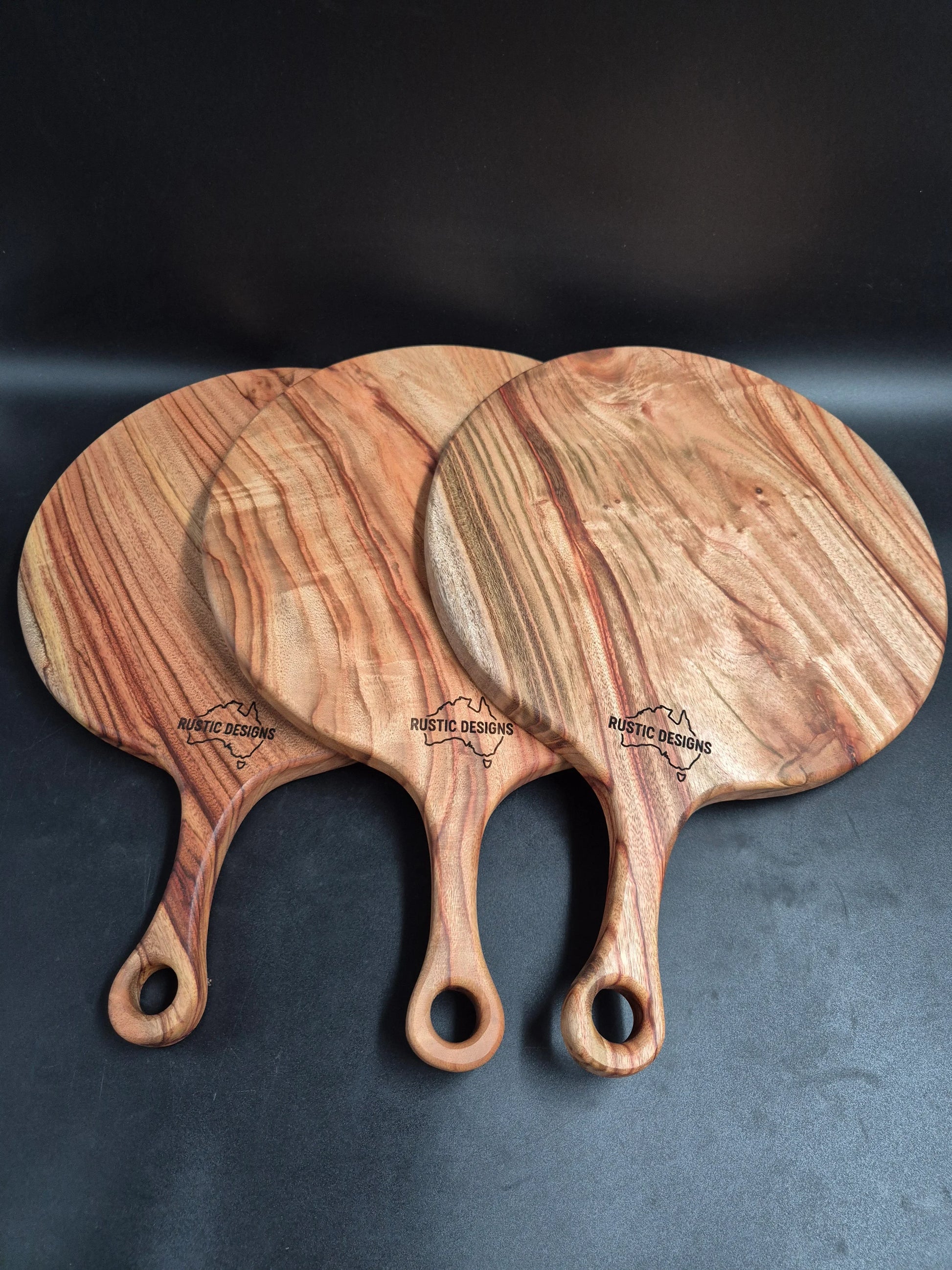 Australian made chopping board, pizza board, Camphor Laurel chopping board, solid timber chopping board, handmade chopping board, wooden serving board, grazing board, charcuterie board, large serving board, non-toxic chopping board, low-tox kitchenware, eco-friendly kitchenware, food-safe chopping board, sustainable timber kitchenware, Australian hardwood chopping board, one piece chopping board, no glues no joins, handmade wooden board.