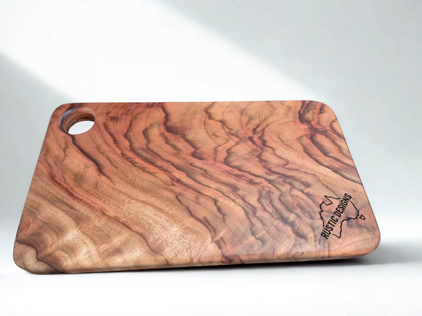 Australian made chopping board, small chopping board, Camphor Laurel chopping board, solid timber chopping board, handmade chopping board, wooden serving board, grazing board, charcuterie board, non-toxic chopping board, low-tox kitchenware, eco-friendly kitchenware, food-safe chopping board, sustainable timber kitchenware, Australian hardwood chopping board, one piece chopping board, no glues no joins, handmade wooden board.