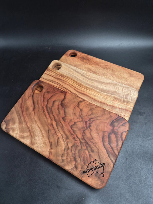  Australian made chopping board, small chopping board, Camphor Laurel chopping board, solid timber chopping board, handmade chopping board, wooden serving board, grazing board, charcuterie board, non-toxic chopping board, low-tox kitchenware, eco-friendly kitchenware, food-safe chopping board, sustainable timber kitchenware, Australian hardwood chopping board, one piece chopping board, no glues no joins, handmade wooden board.